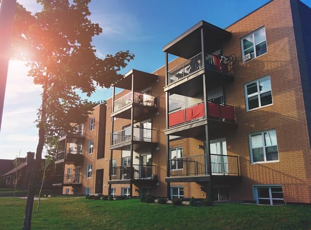 Garden-style apartment complex with landscaped grounds